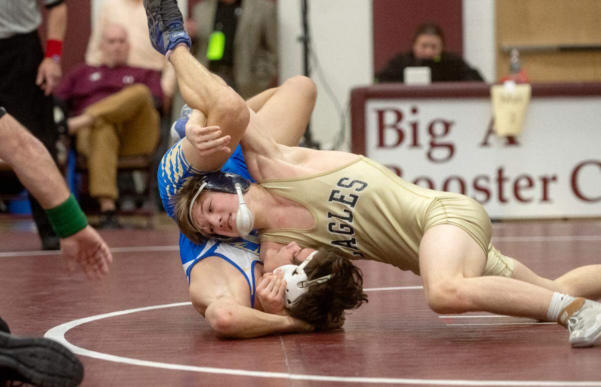 Bald Eagle Area’s Coen Bainey rolls Mount Union’s Jacik Hess in the 127 lb championship bout of the District 6 2A championships on Saturday, Feb. 18, 2023.