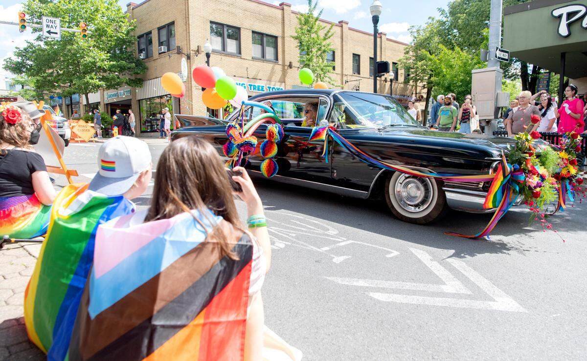 Community members line Allen Street for the State College “Pride Ride” parade on Saturday, June 11, 2022.  