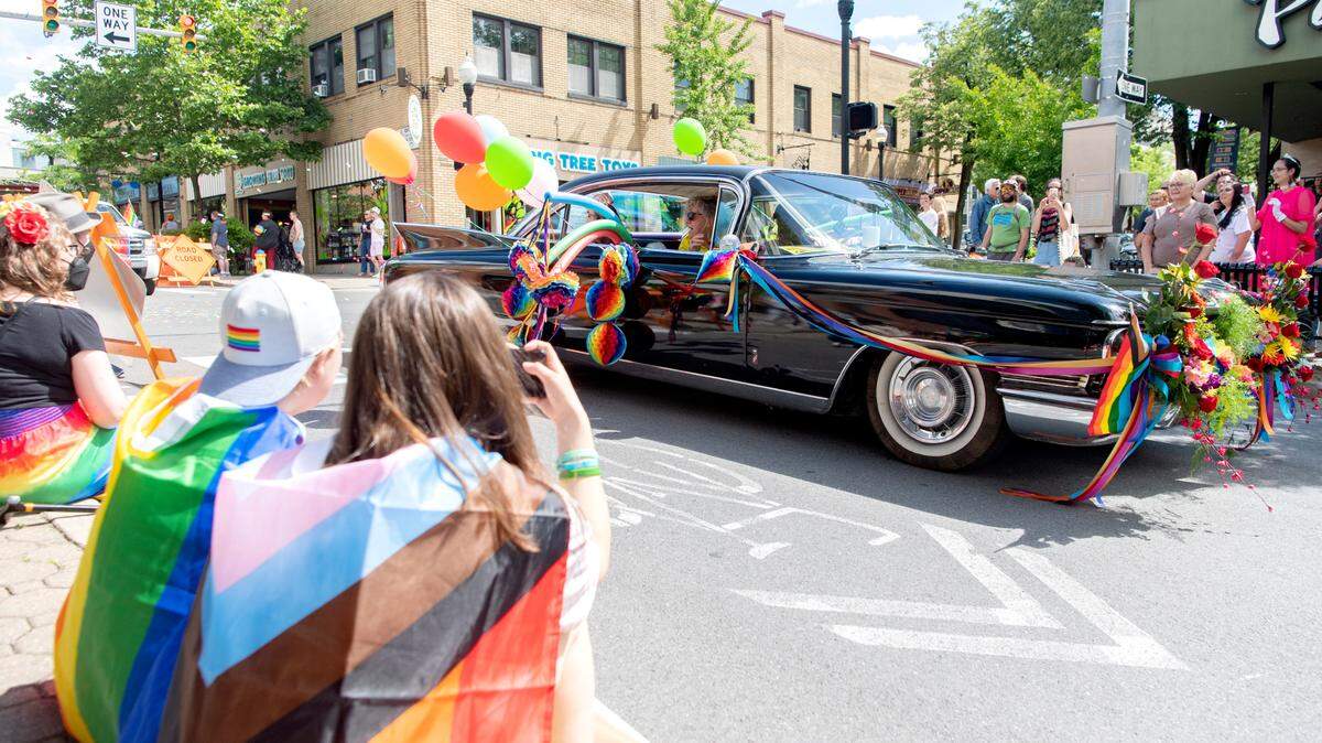 Community members line Allen Street for the State College “Pride Ride” parade on Saturday, June 11, 2022.