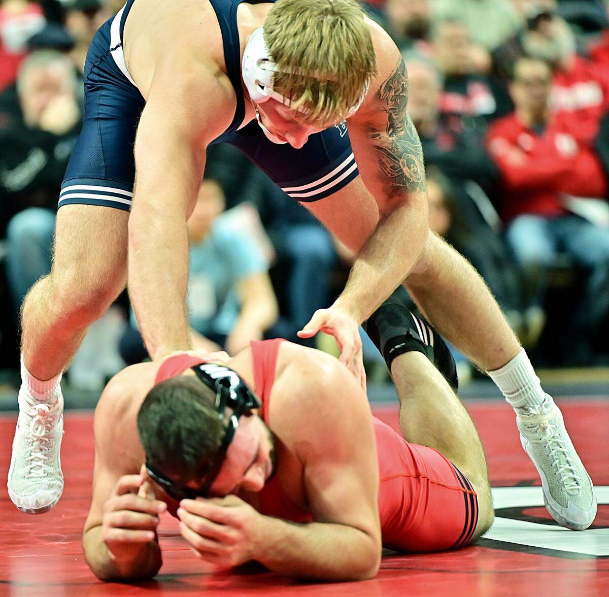 Penn State’s Josh Barr looks to let Rutgers’ John Poznanski up during their 197-pound bout of the Nittany Lions’ 35-3 win on Friday in Piscataway, NJ. Barr recorded all 22 points that included 7 takedowns in the third period of his 22-6 win.