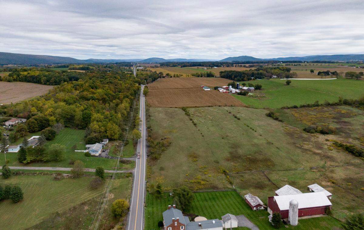 Traffic travels along state Route 45 in Potter Township on Wednesday, Oct. 5, 2022.  There is a proposed connector to U.S. Route 322 through the farm fields. 
