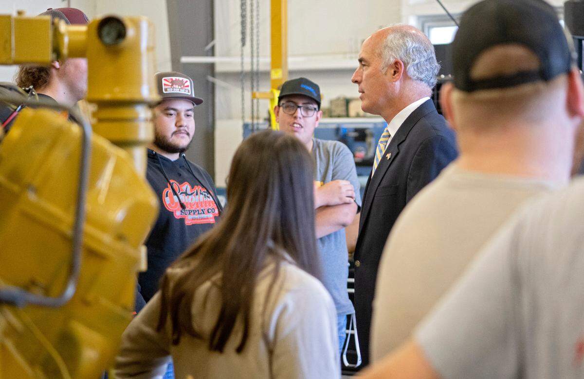 Sen. Bob Casey chats with students in the Natural Gas Compression class at the Central Pennsylvania Institute of Science and Technology on Thursday, Aug. 25, 2022.