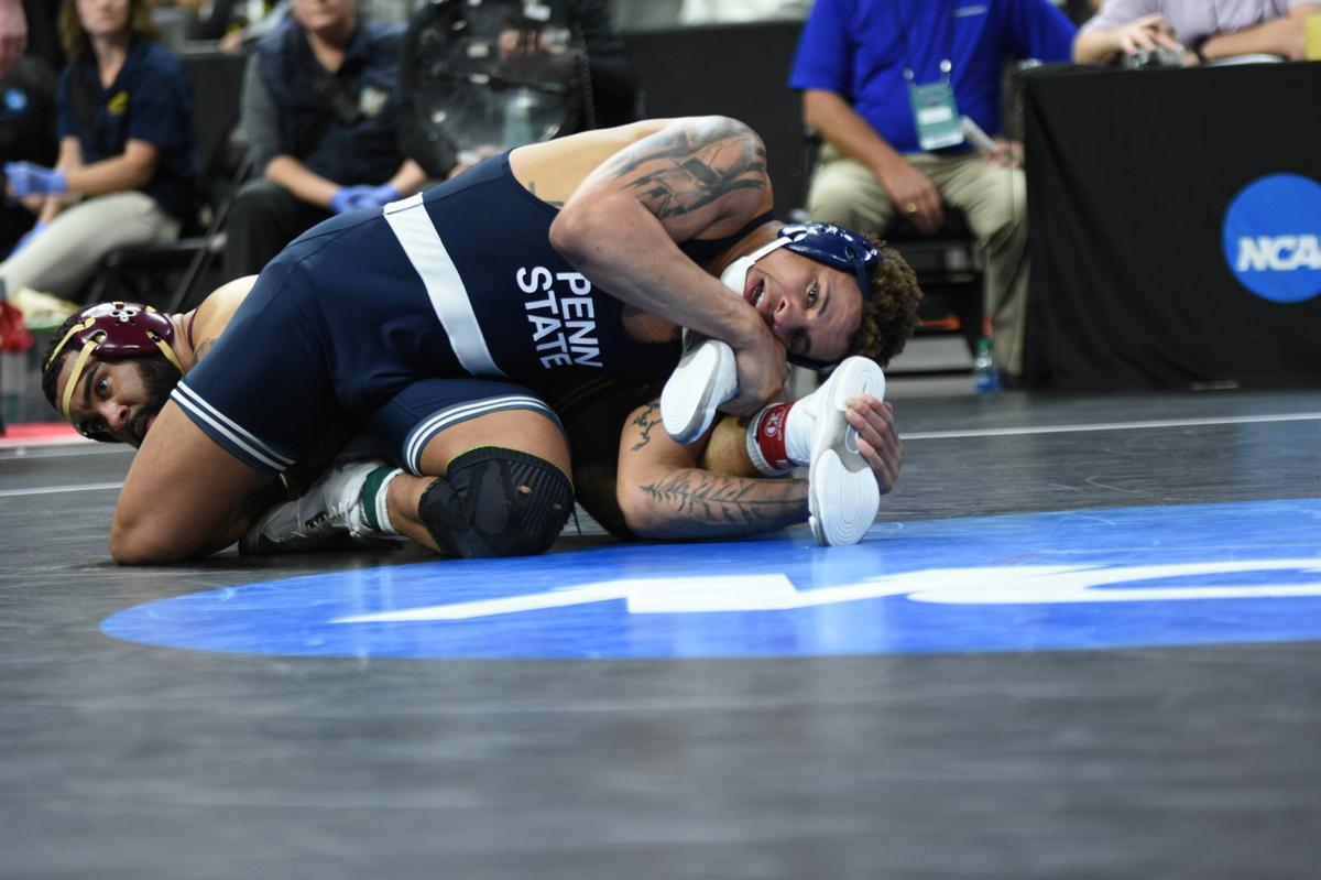 Penn State’s Greg Kerkvliet scrambles with Minnesota’s Gable Steveson in their 285-pound semifinals match of the NCAA Championships on Friday, March 18, 2022 at Little Caesars Arena in Detroit. Steveson topped Kerkvliet, 8-3.