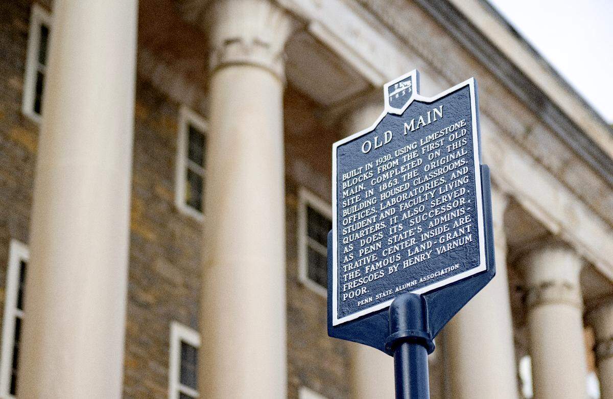 The Penn State Alumni Association historical marker outside of Old Main.