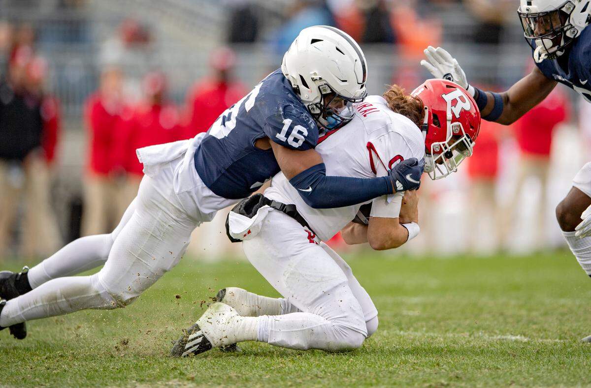 Penn State safety Ji’Ayir Brown stops RutgersÕ quarterback Noah Vedral during the game on Saturday, Nov. 20, 2021.