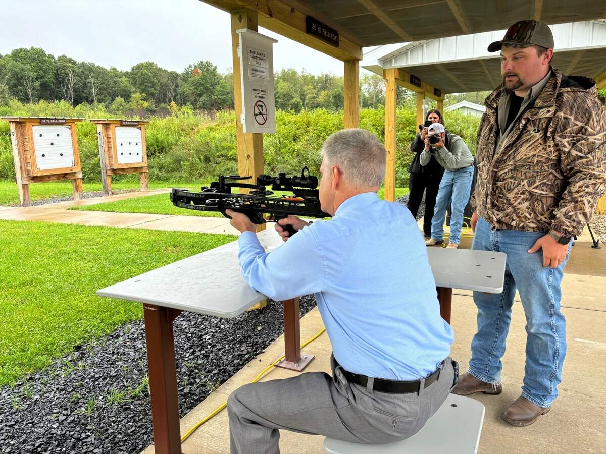 Rep. Scott Conklin, D-Rush Township, tries the new archery range at as the Pennsylvania Game Commission opens their improved range at State Game Lands 176 on Thursday, Aug. 8, 2024.