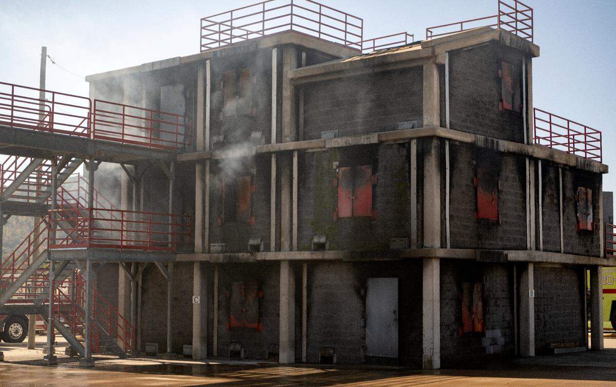 Smoke rises from the burn building at the Centre County Public Safety Training Center during a training session for the firefighters from the University Park Airport on Wednesday, Oct. 11, 2023.
