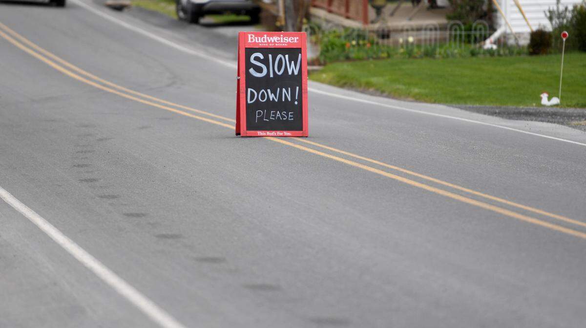A sign outside of the Hublersburg Inn on Hublersburg Road on April 27 urges drivers to slow down. There were three fatal crashes in late April on state Route 64.