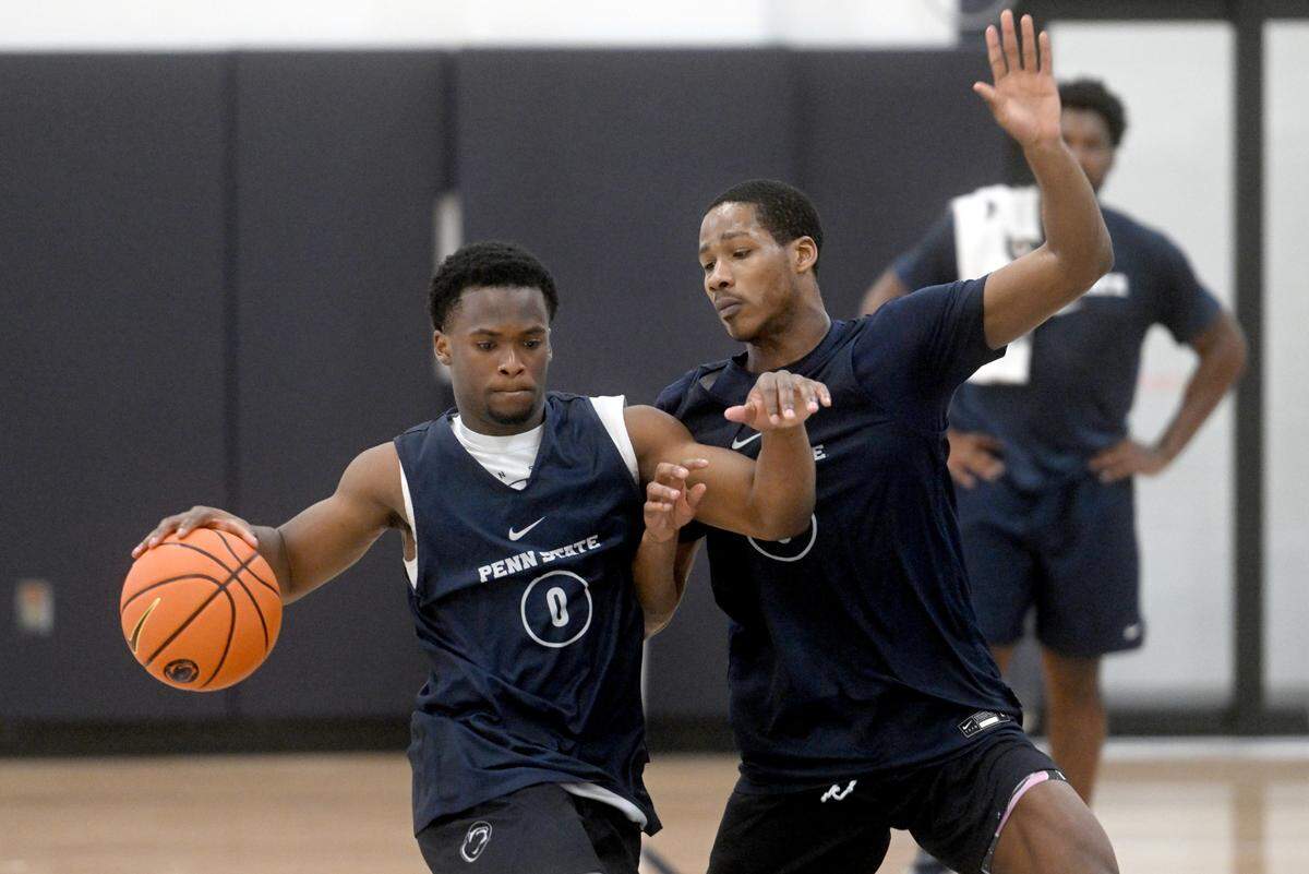 Penn State’s Kanye Clary dribbles around Jameel Brown during a men’s basketball summer workout on Tuesday, July 11, 2023.