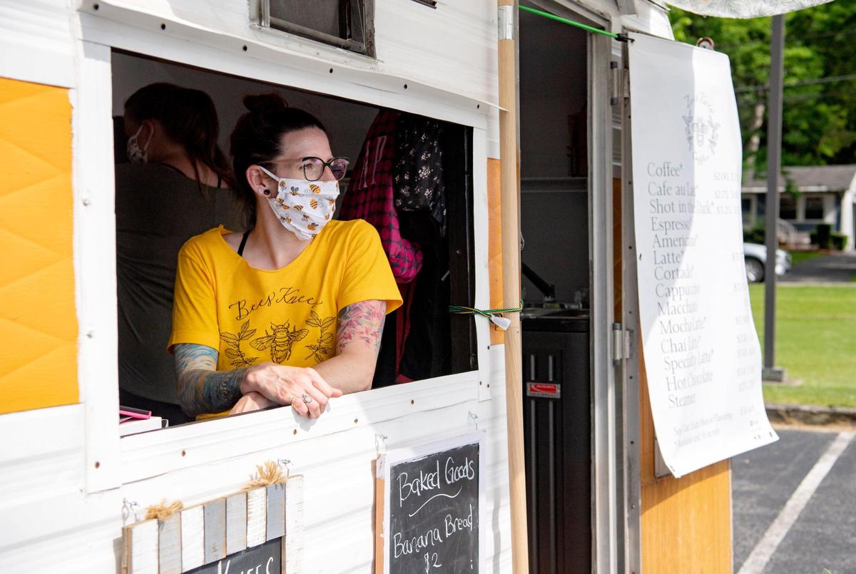 Bromlyn Ftizgerald chats with customers at of Bees Knees Coffee at the Pine Grove Mills farmers market on Thursday, June 18, 2020.