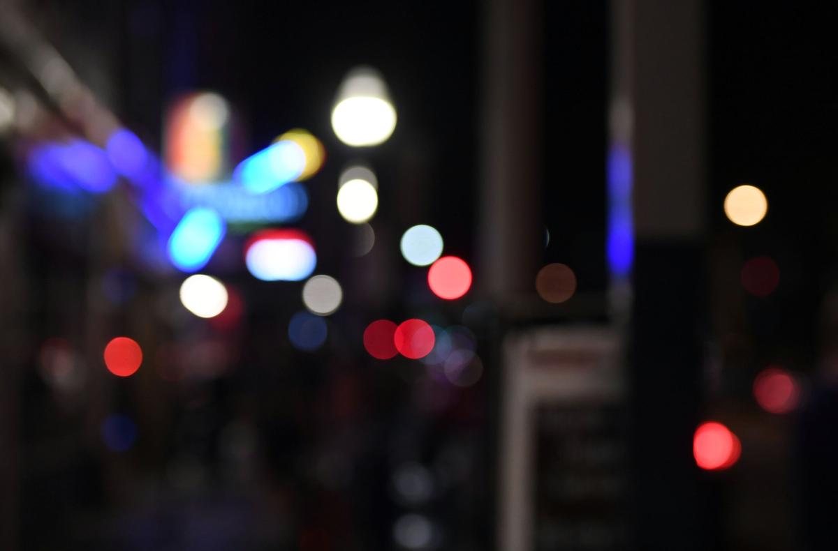 Lights of bars and restaurants shine in downtown State College Thursday, Aug. 30, 2018.