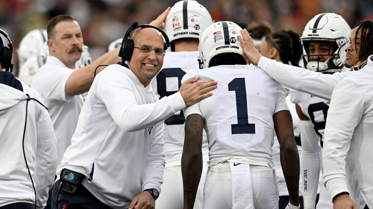 Penn State football coach James Franklin celebrates after a touchdown during the Rose Bowl against Utah.
