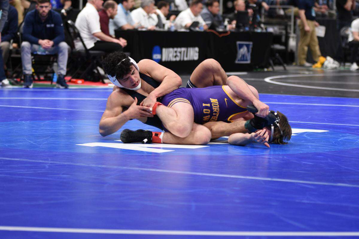 Penn State’s Beau Bartlett scrambles with Northern Iowa’s Colin Realbuto in their 149-pound first round bout of the NCAA Championships on Thursday, March 17, 2022 at Little Caesar’s Arena in Detroit. Bartlett snuck by Realbuto, 5-4.
