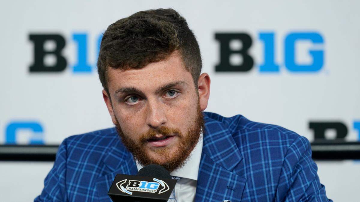 Penn State quarterback Sean Clifford talks to reporters during an NCAA college football news conference at the Big Ten Conference media days, at Lucas Oil Stadium, Wednesday, July 27, 2022, in Indianapolis.
