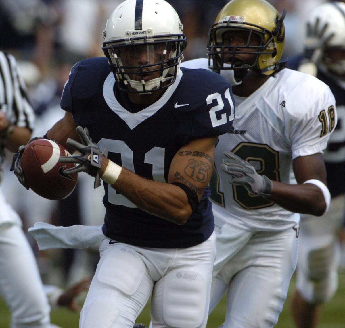 Penn State’s Alan Zemaitis (21) runs a fumble recovery in for a touchdown against South Florida’s Amarri Jackson (18) in the 1st quarter during their game on Saturday, Sept. 3, 2005.