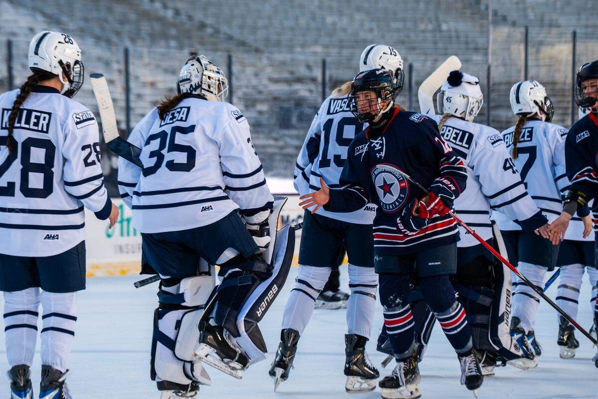 Robert Morris forward Jessica MacKinnon (28) shakes the hands of Penn State players after the Penn State women’s hockey game at Beaver Stadium on Friday, Jan. 30, 2026.