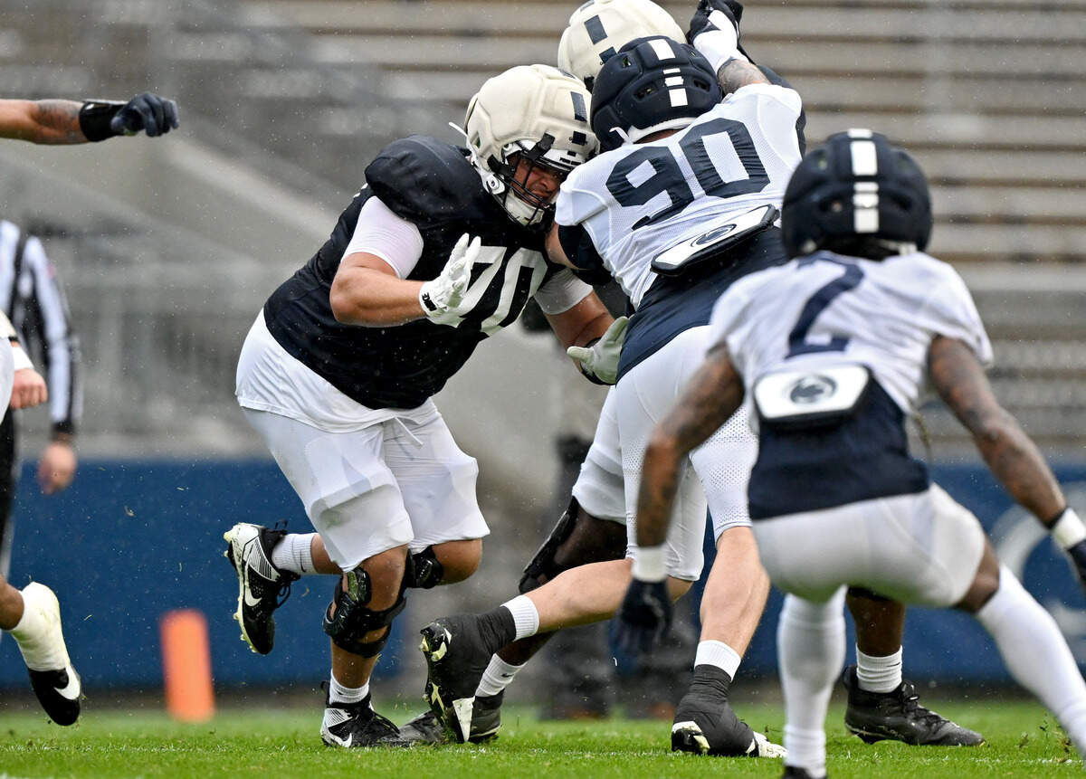 Penn State offensive lineman Trevor Buhr blocks defensive tackle Liam Andrews during Blue-White Practice on Saturday, April 25, 2026.