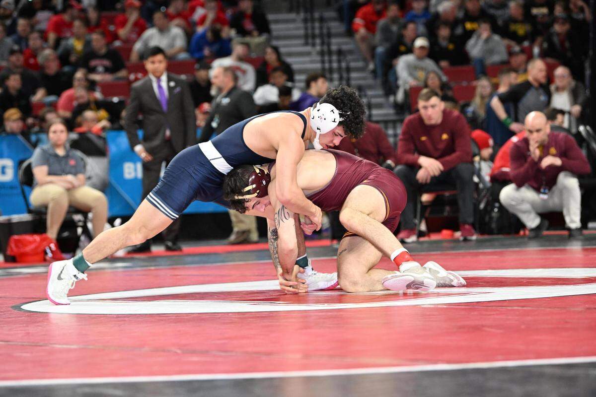 Penn State’s Beau Bartlett fights off a takedown attempt from Minnesota’s Michael Blockhus in their 149-pound Big Ten first round match on Saturday, March 5, 2022 in Lincoln, Neb. Bartlett edged Blockhus, 3-2.