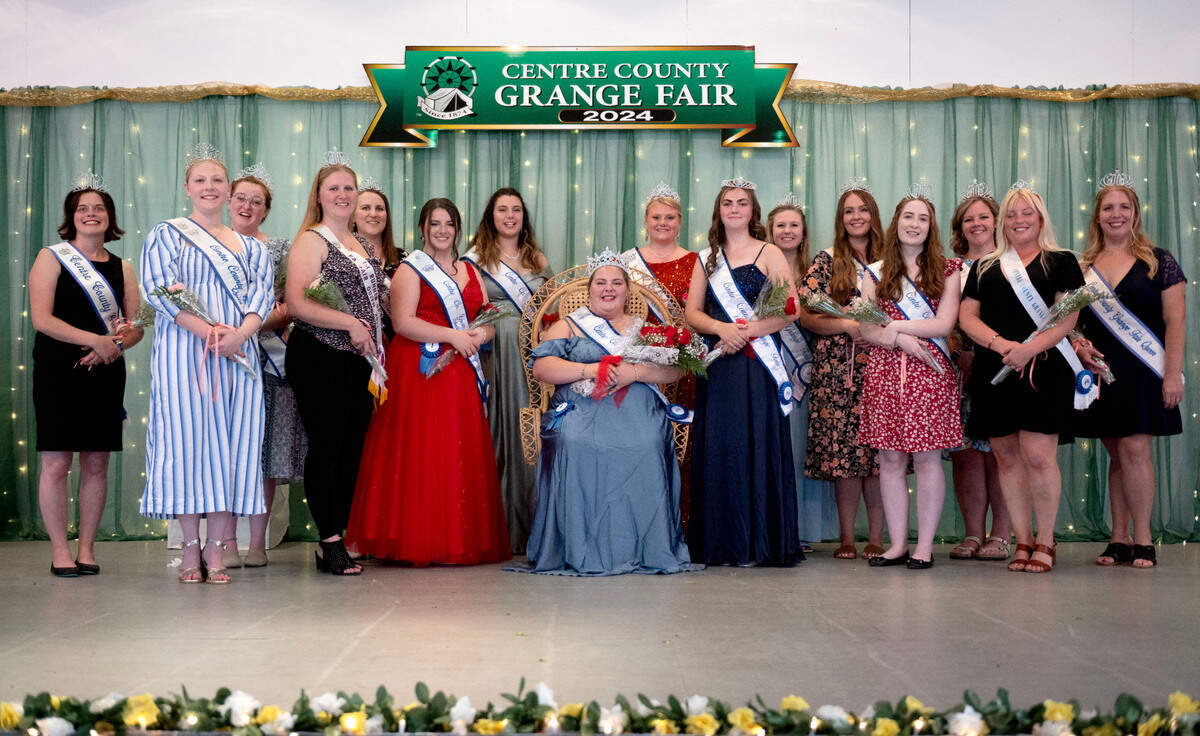 Former Grange Fair queens and ambassadors gather around the 2024 Centre County Grange Fair Queen Kryslynn Ronk on Wednesday, Aug. 14, 2024.