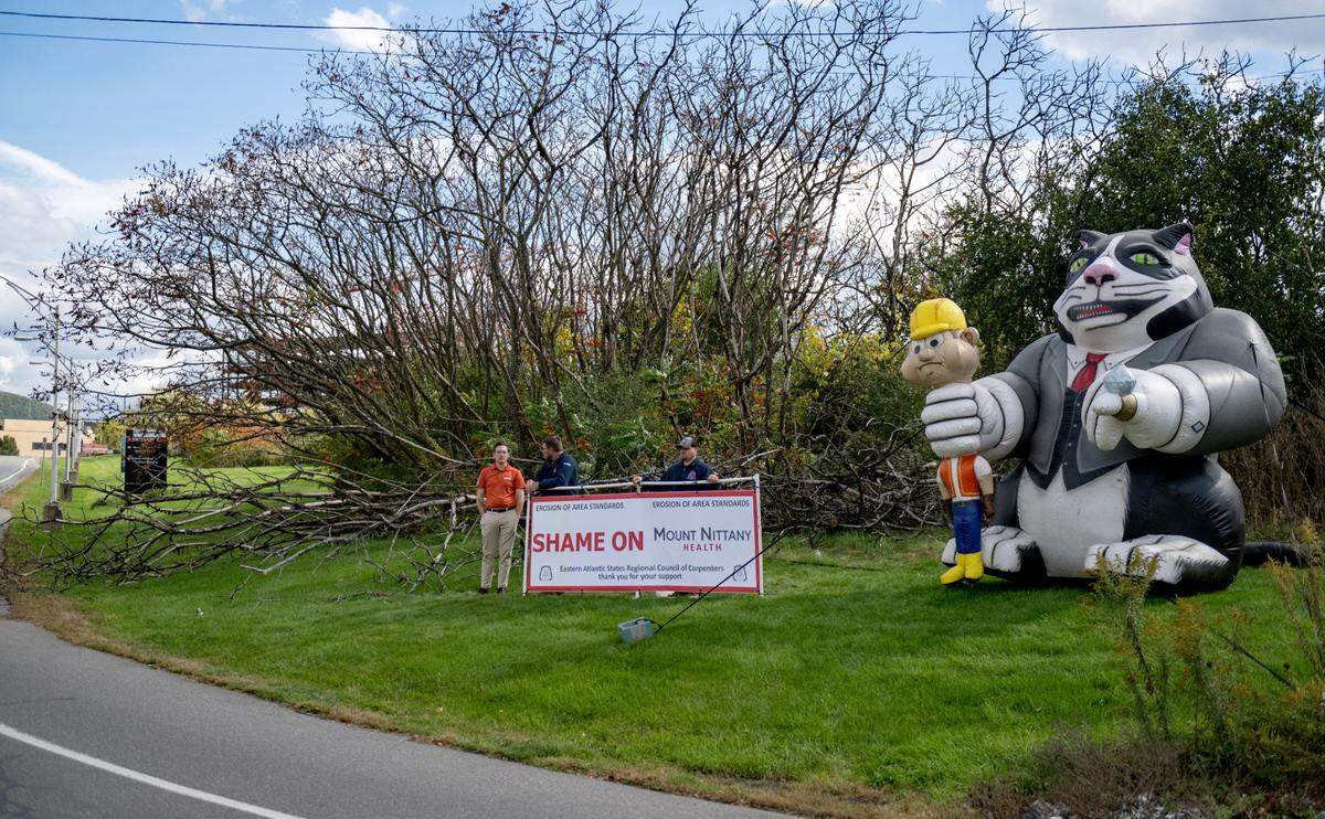 Members of the Eastern Atlantic States Regional Council of Carpenters stood at the intersection of Park Avenue and Hospital Drive on Tuesday, Oct. 8, 2024 to let the public know they are frustrated with Mount Nittany Health.