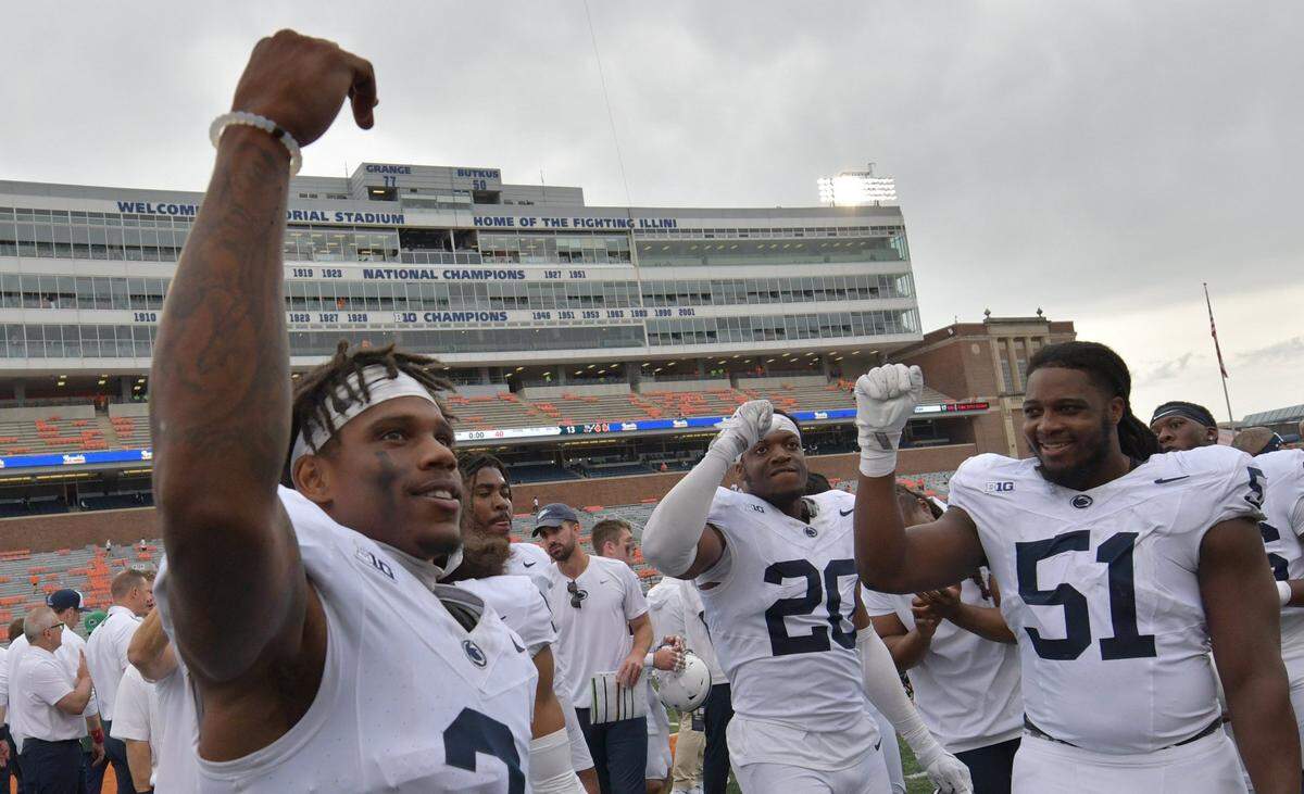 Sep 16, 2023; Champaign, Illinois, USA;  Penn State Nittany Lions players celebrate after defeating the Illinois Fighting Illini at Memorial Stadium. Mandatory Credit: Ron Johnson-USA TODAY Sports