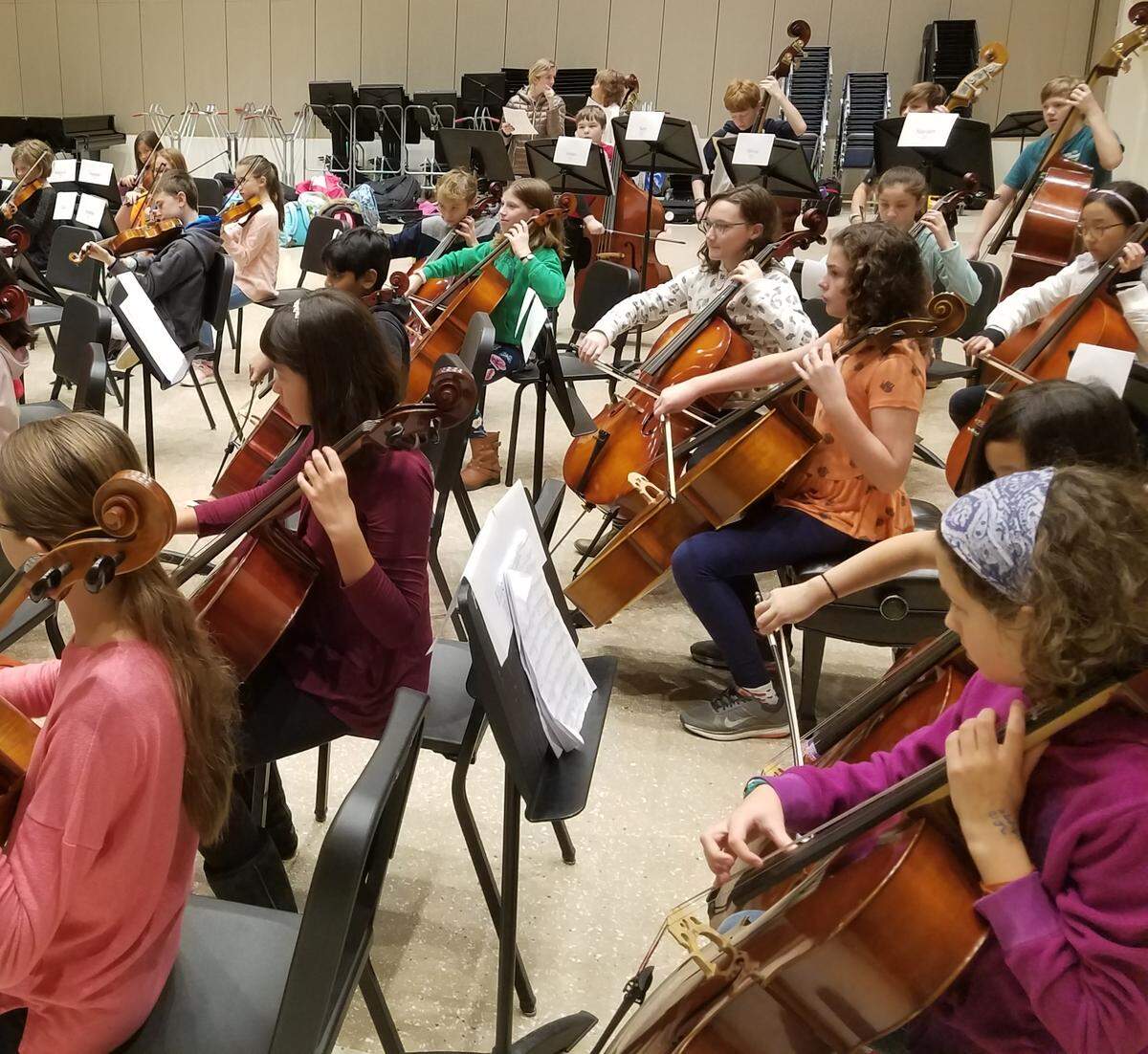 The string orchestra rehearses Wednesday morning in Esber Rehearsal Room at the Penn State School of Music for the upcoming Partners in Music concert. The orchestra includes more than 60 fifth grade string players from local elementary schools.