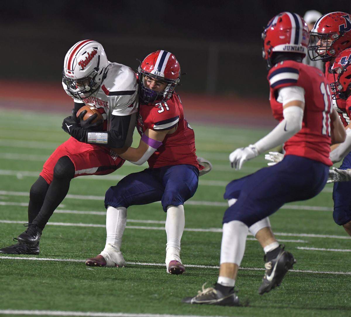 Bellefonte’s Jaeden Gabrovsek is tackled by Juniata’s Gage Harlon in the District 6 Class 4A Championship on Saturday, Nov. 9, at Altoona’s Mansion Park Stadium.