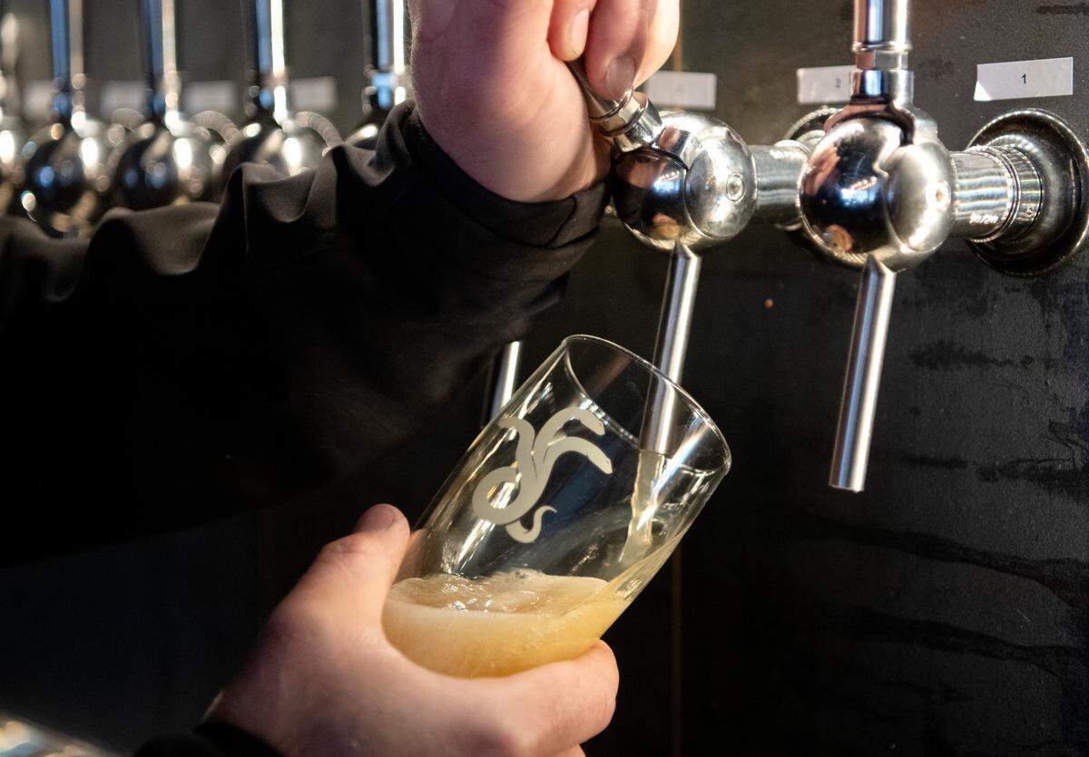 John Schaffer pours an IPA at Antifragile Brewing Company on Calder Way on Wednesday.