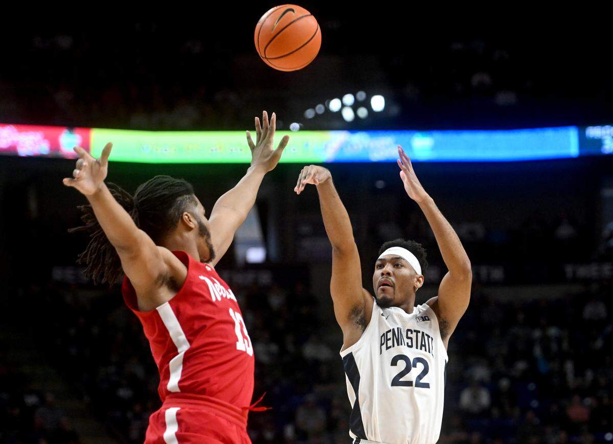 Penn State’s Jalen Pickett shoots for three over Nebraska’s Derrick Walker during the game on Saturday, Jan. 21, 2023.