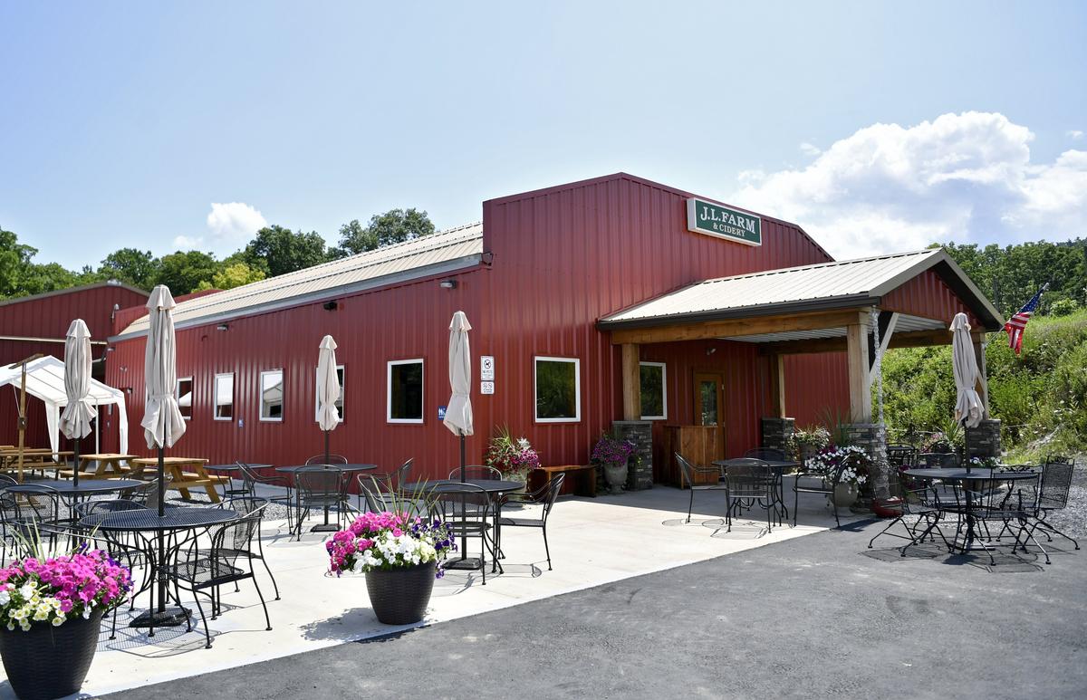 The tasting room and patio at J.L. Farm and Cidery is family friendly and offers a view of the orchards.