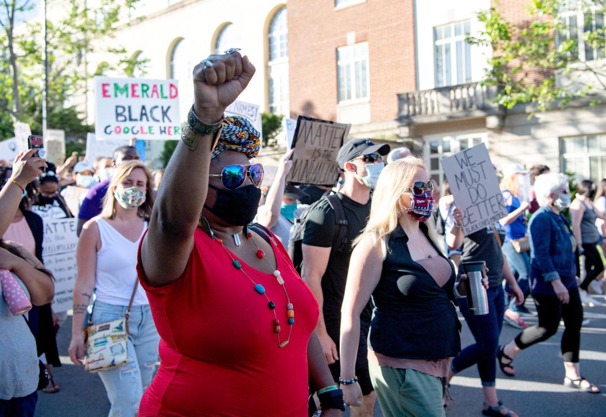 Hundreds of people march down Burrowes Road during a “Justice for Black Lives” protest organized by the 3/20 Coalition on June 7.
