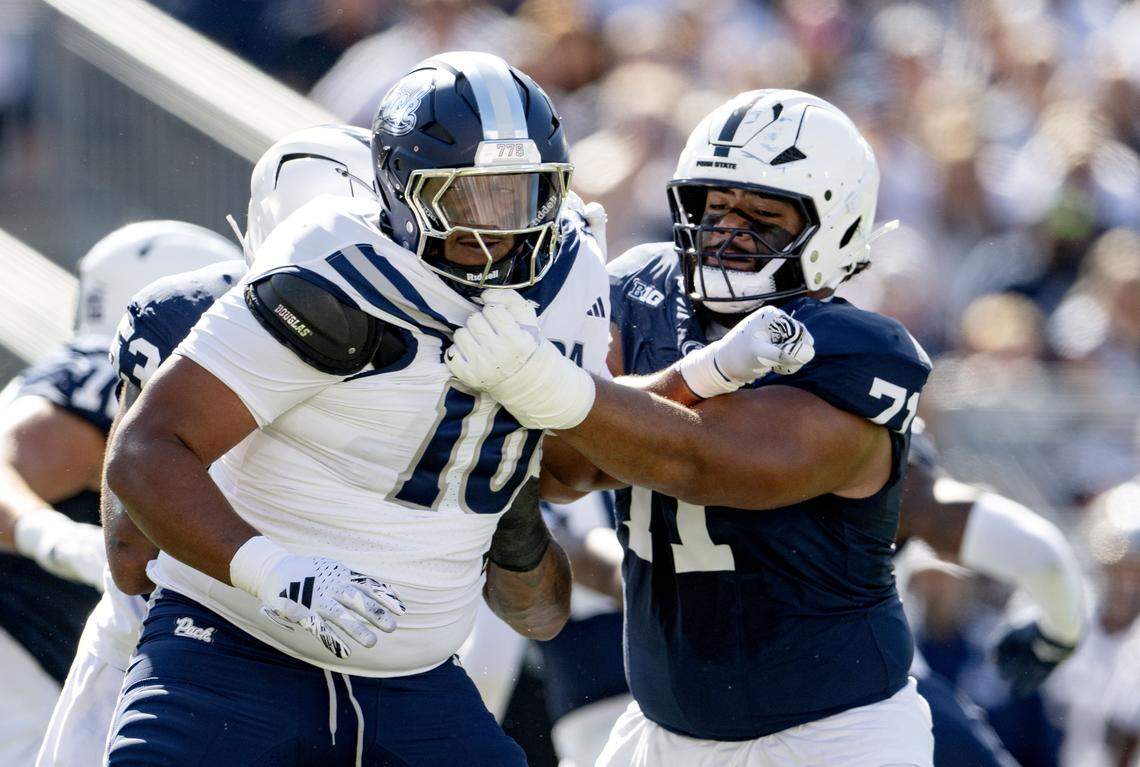 Penn State offensive lineman Vega Ioane, right, blocks Nevada’s Logologo Va’a during the game on Saturday, Aug. 30, 2025 at Beaver Stadium.
