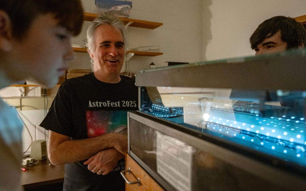 Penn State research professor Isaac Mognet explains the activity in a cloud chamber to visitors at AstroFest on Wednesday, July 9, 2025.
