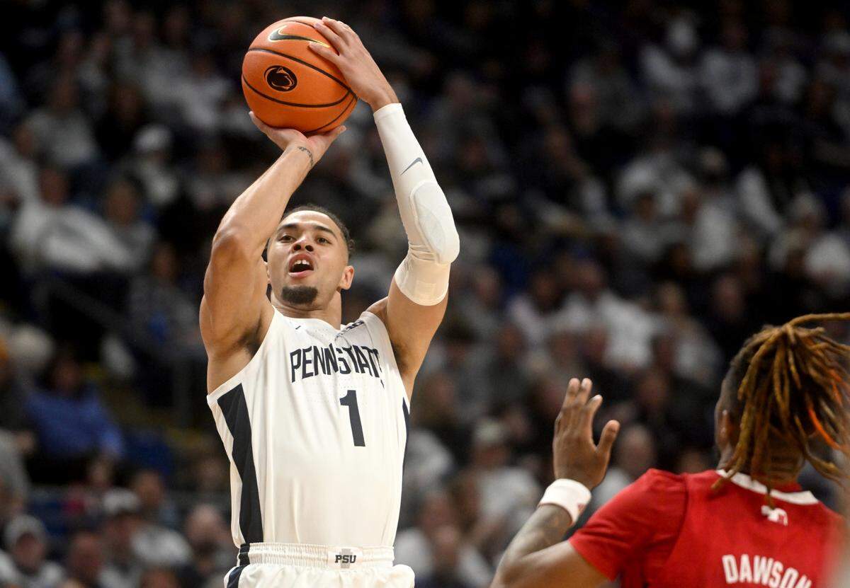 Penn State’s Seth Lundy shoots for three over Nebraska defenders during the game on Saturday, Jan. 21, 2023.