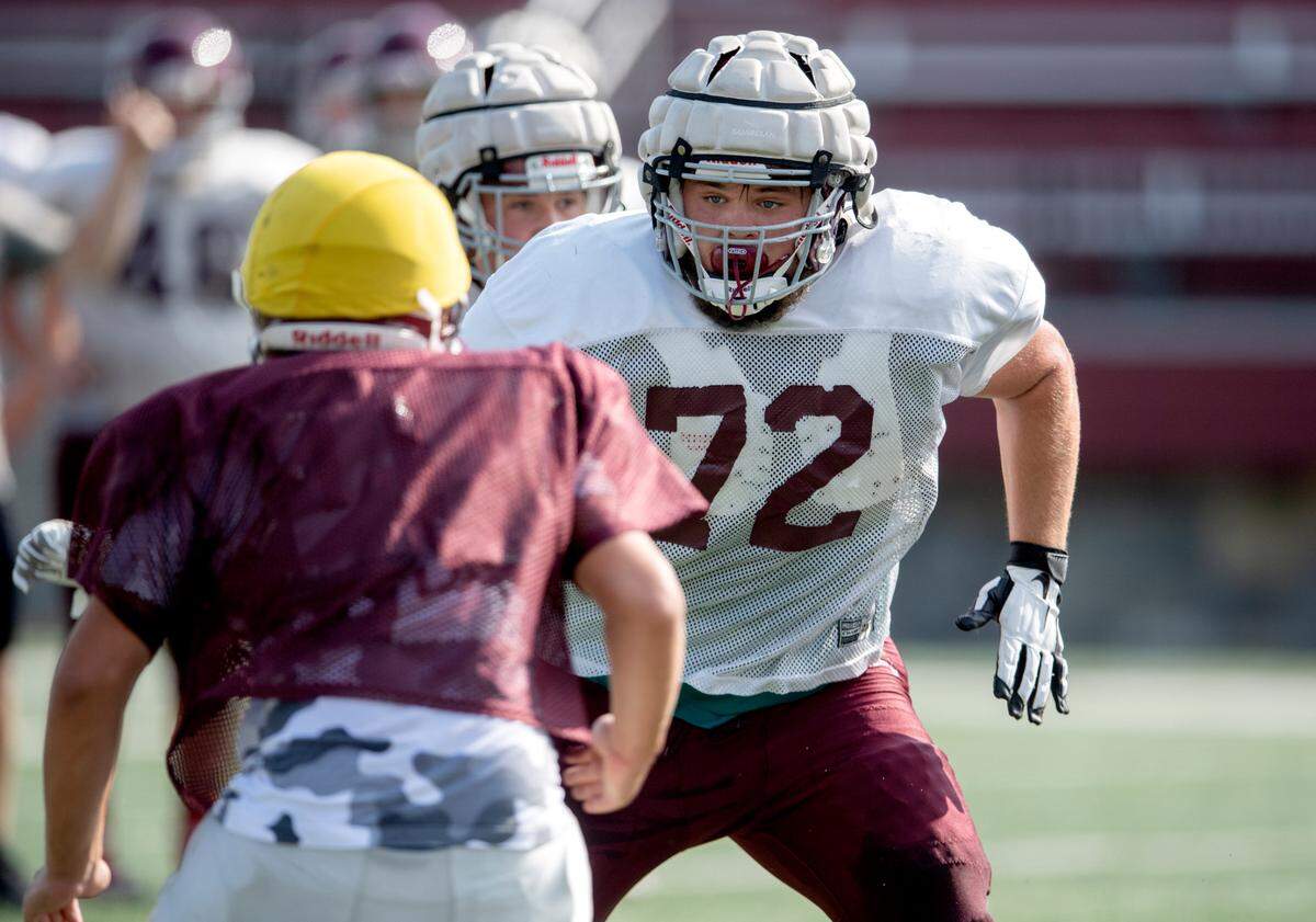 State College’s Michael Dincher runs a play during practice on Friday, Aug. 20, 2021.