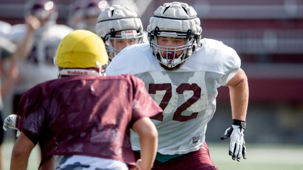 State College’s Michael Dincher runs a play during practice on Friday, Aug. 20, 2021.