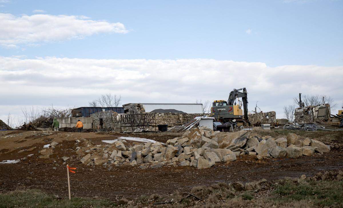 Crews are demolishing a barn as work begins for a Home2Suites by Hilton at 1764 E. Trout Drive on  Thursday, Dec. 18, 2025.  