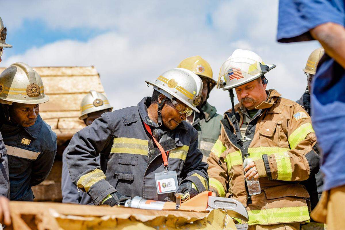 MIke Kull, right, works with a crew of firefighters through Africa Fire Mission.