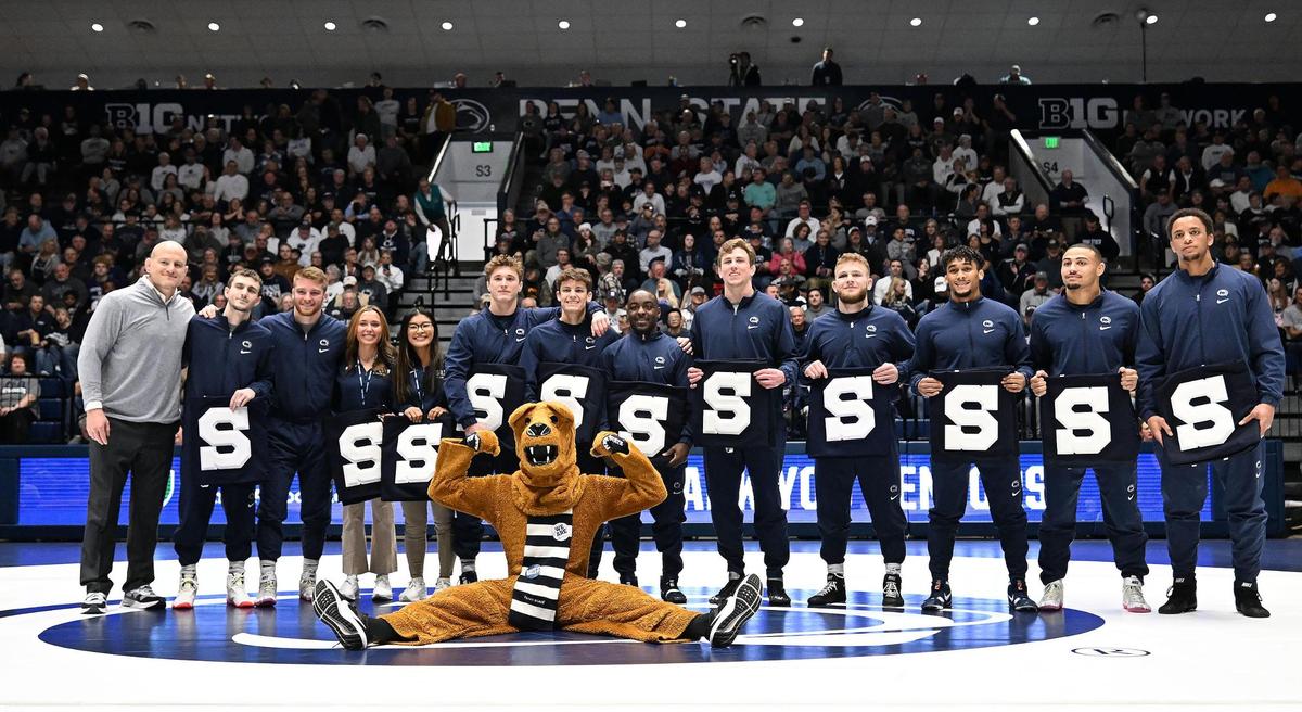 Penn State celebrates all of its seniors, which included Penns Valley graduate Baylor Shunk (seventh from left), before the Nittany Lions routed Edinboro, 55-0, on Sunday inside Rec Hall.