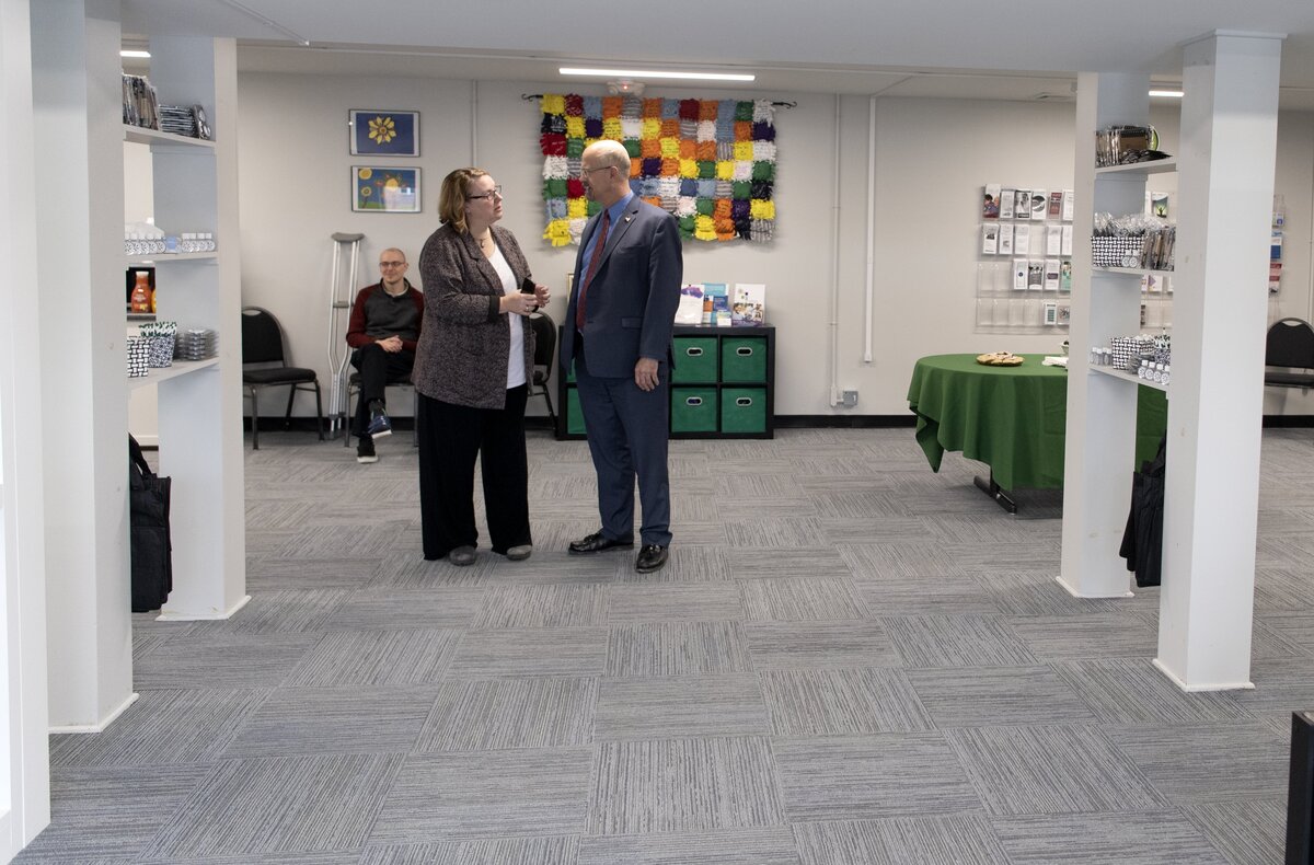 Natalie Corman talks with Centre County Commissioner Mark Higgins at the new Center for Community Resources on Dec. 2.