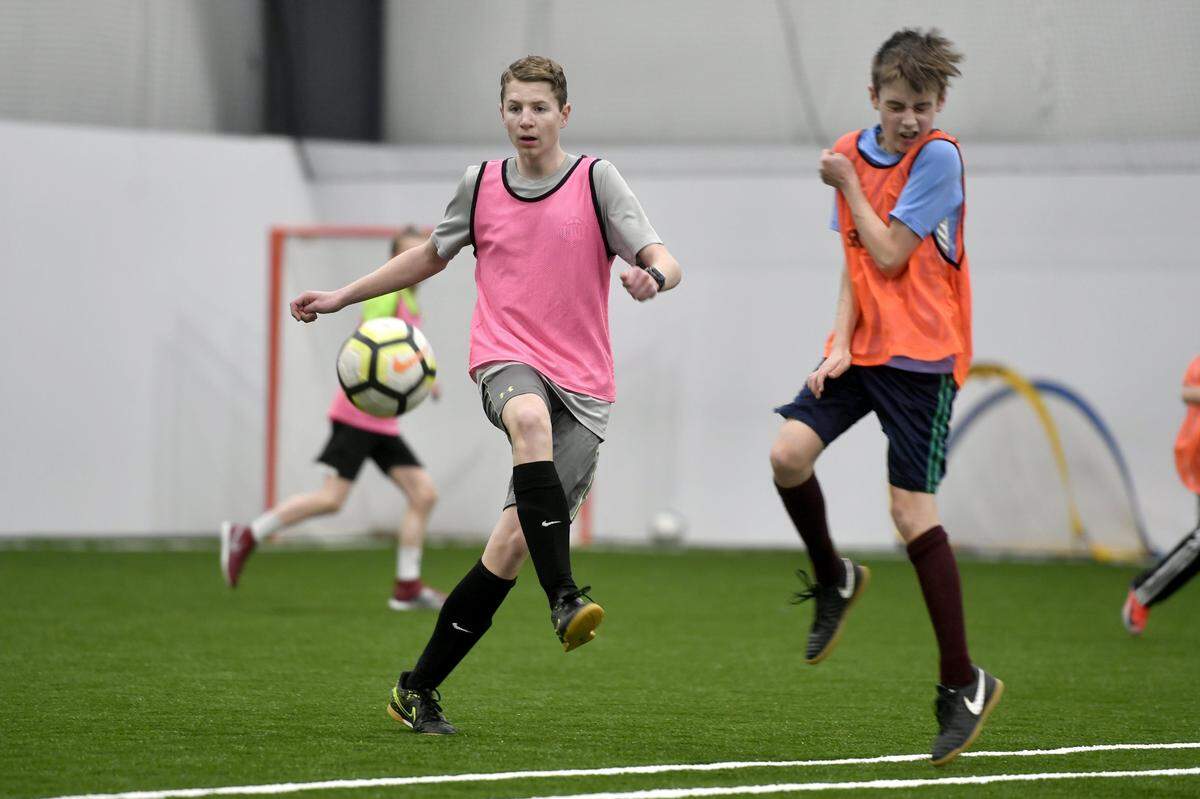 A Penn United Soccer Academy team practices at the Nittany Valley Sports Centre on Wednesday, Feb. 27, 2019.