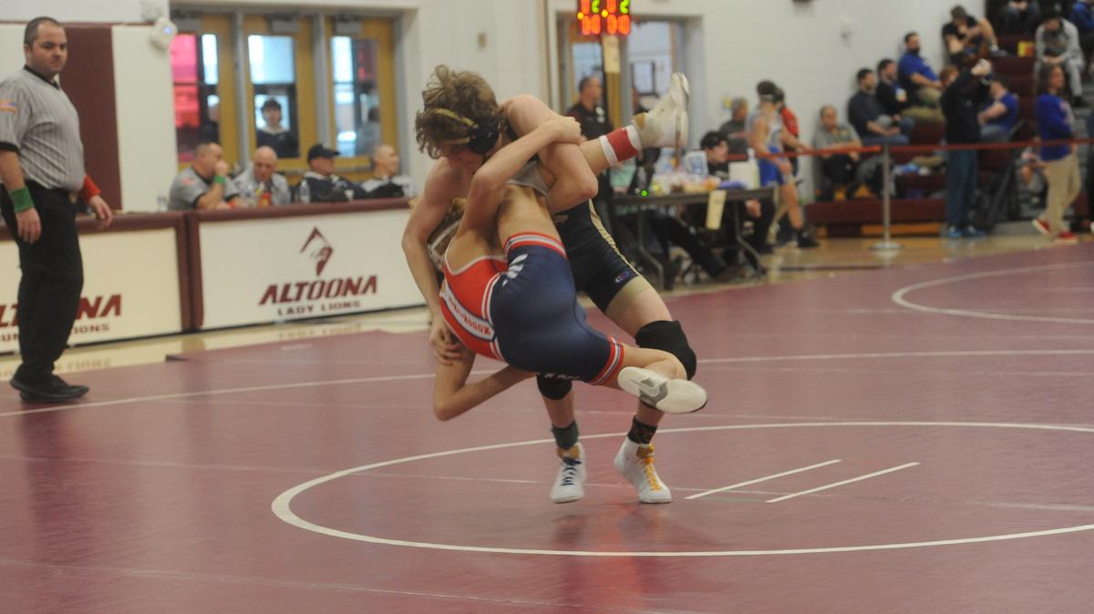 Bald Eagle Area’s Lucas Fye looks to finish off a takedown of Huntingdon’s Ryan Yocum in their 121-pound quarterfinals match of the District 6 Class 2A Championships on Friday, Feb. 17, 2023 in Altoona. Fye shut out Yocum, 8-0, to make the semifinals.