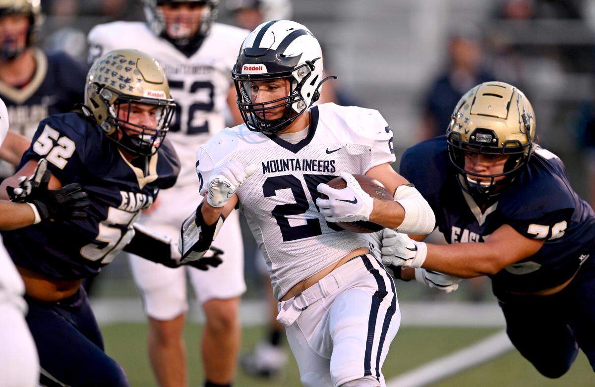 Bald Eagle Are defenders try to stop Philipsburg-Osceola’s Jakodi Jones as he cuts down the field with the ball during the game on Friday, Sept. 22, 2023.