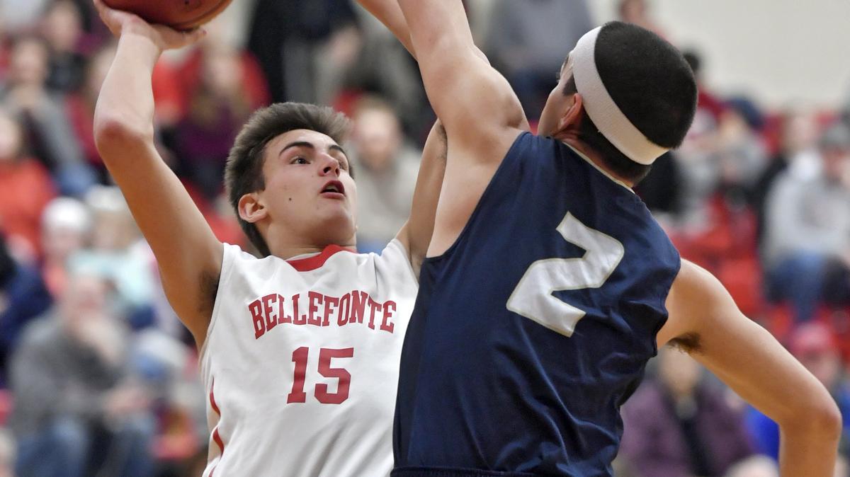 Bellefonte’s Benjamin McCartney goes in for a basket over Hollidaysburg’s Jaden Delerme during the District 6 5A semi-final game on Tuesday, Feb. 19, 2019. Bellefonte won, 46-34.