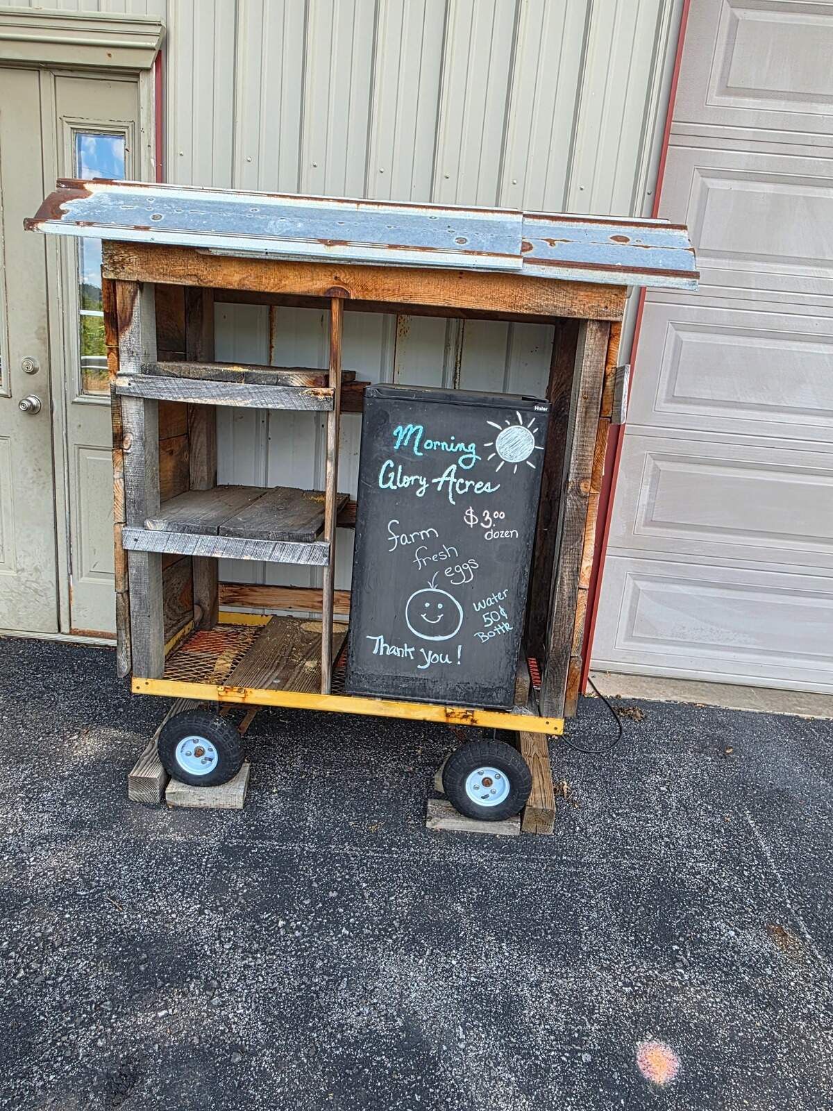 Fresh eggs sign sits outside a barn at Morning Glory Acres on Wednesday, June 17, 2026.