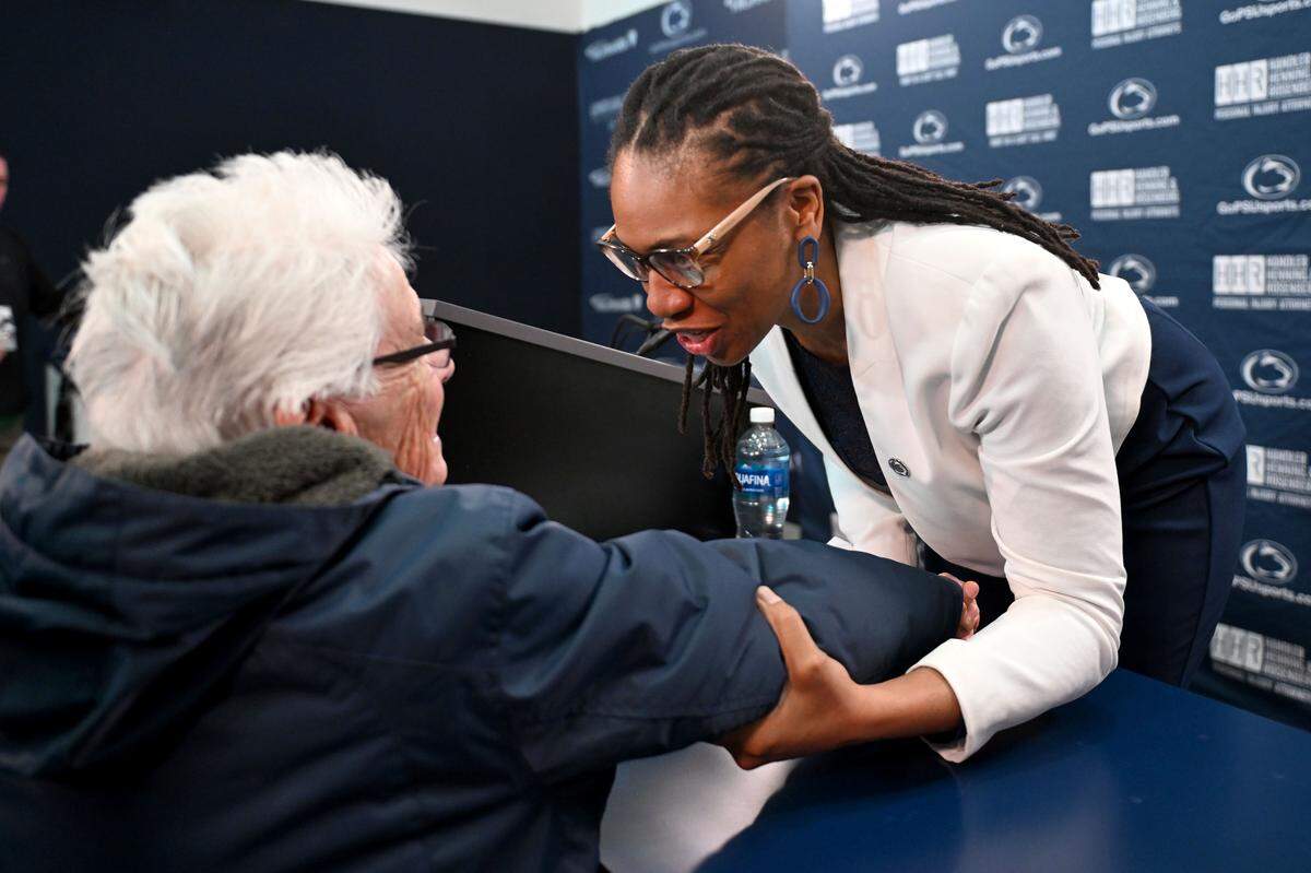 New Penn State Lady Lions coach Tanisha Wright greets a member of the Nittany Lion Club after her introductory press conference on Monday, March 23, 2026.  
