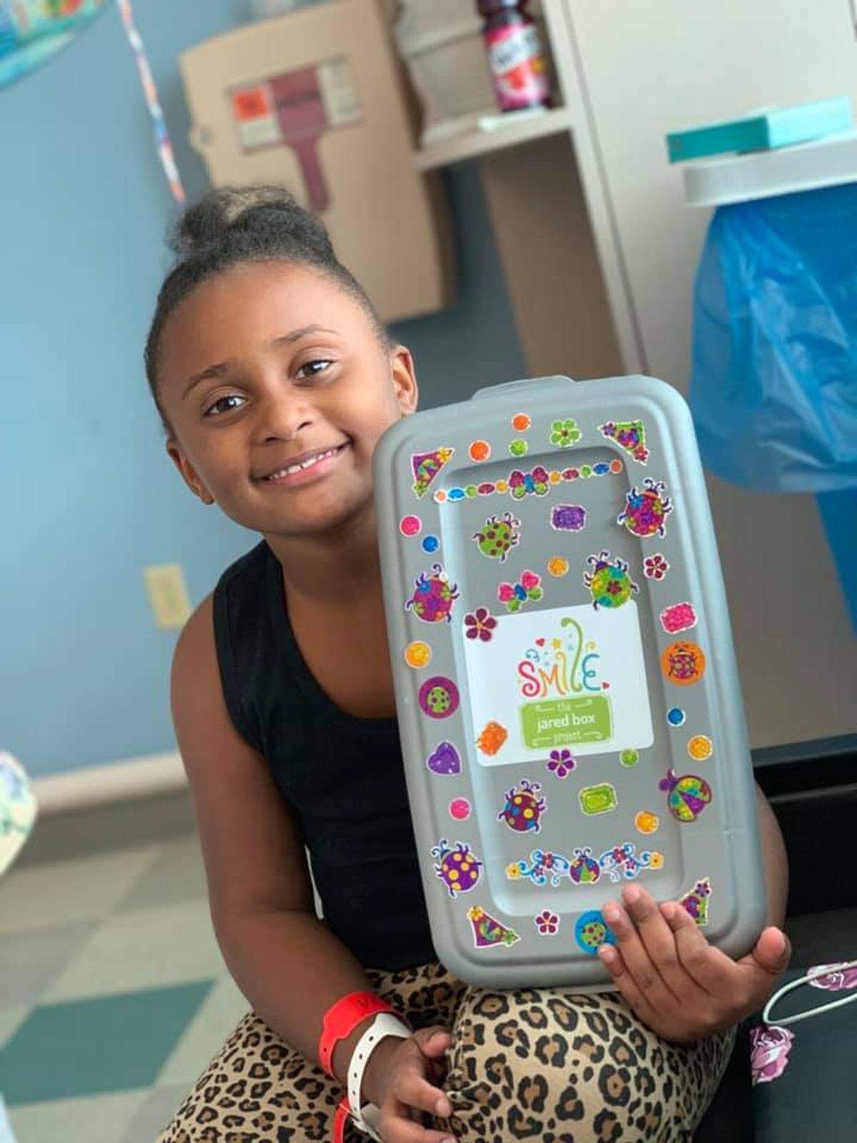 A child receives a Jared Box.
