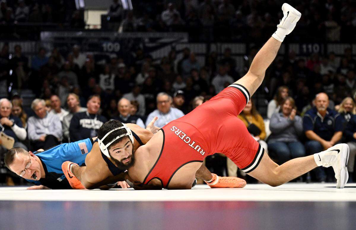 Penn State’s Shane Van Ness tries to roll Rutgers’ Devon Magro in the 149 lb bout of the match on Saturday, Jan. 10, 2026 in Rec Hall.