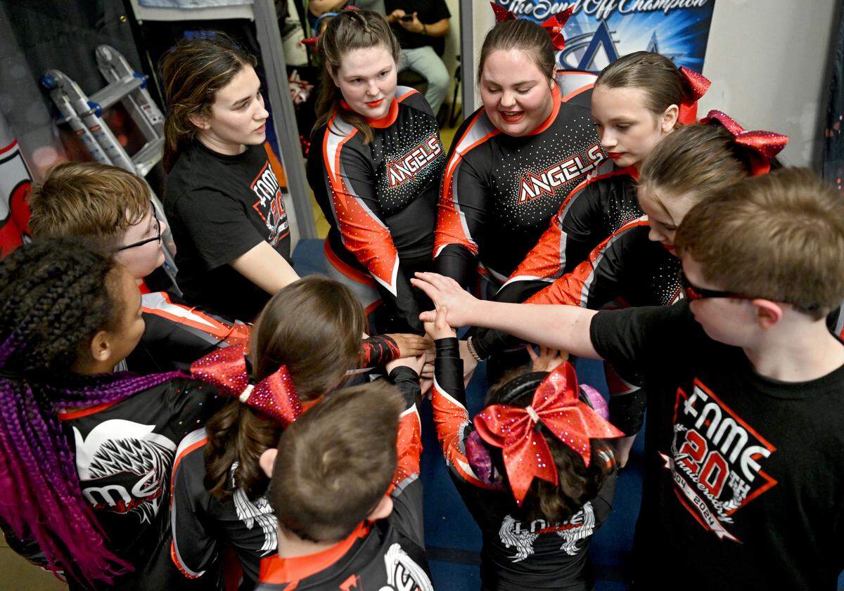 The Fame Angels gather together before practicing their routine on Tuesday, March 12, 2024.