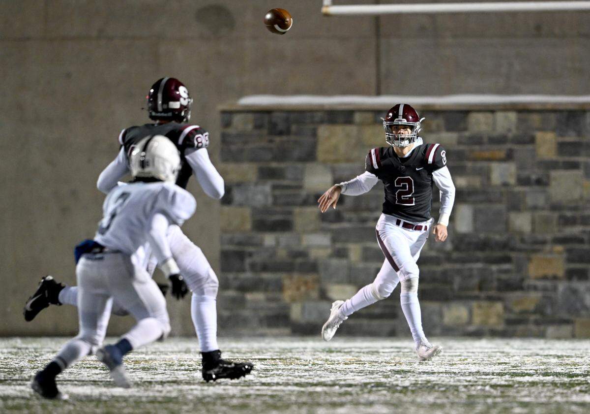 State College’s Finn Furmanek makes a pass to Stephen Scourtis during the game against McDowell on Friday, Nov. 18, 2022.